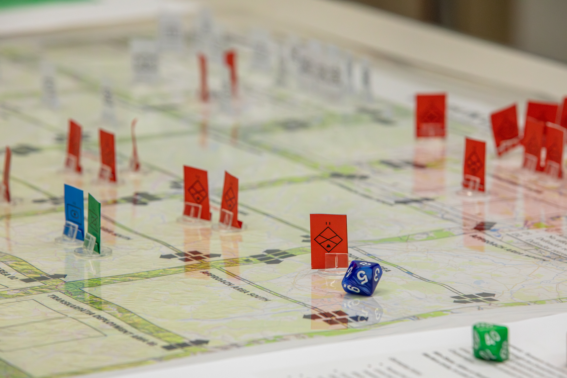 Participants engaged in military wargaming